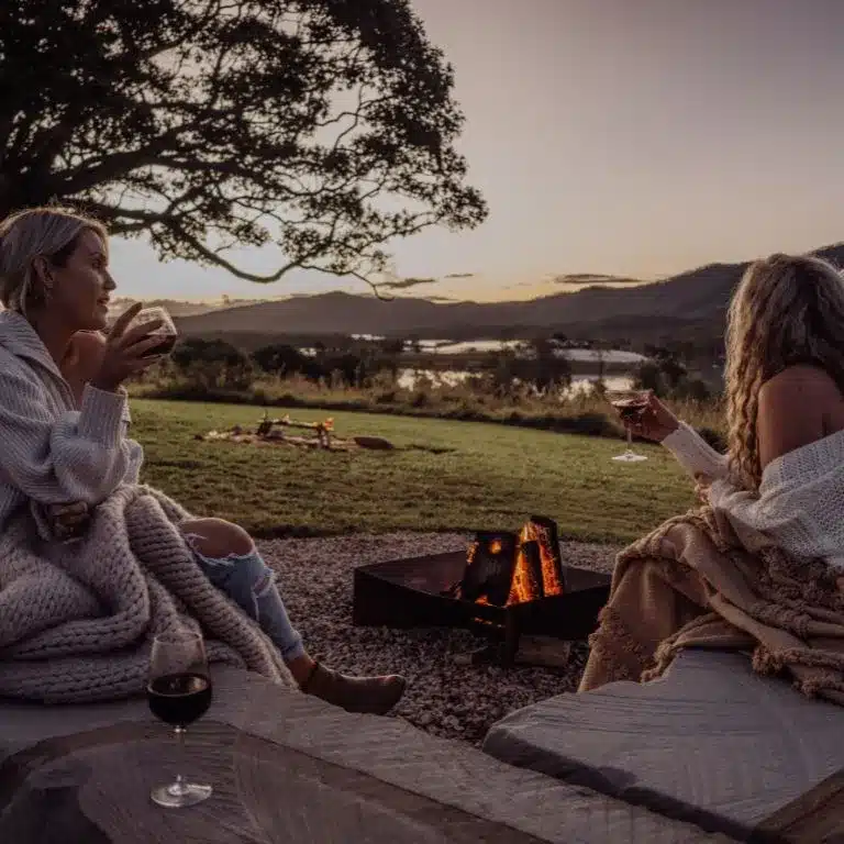 Wander-at-The-Overflow_Lifestyle_132_Credit_Jacqui-Faulkner- for mobile Friends wrapped in blankets sharing wine by the firepit, Scenic Rim